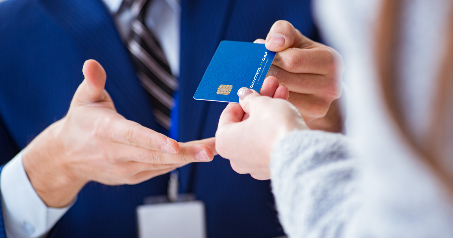 hand passing credit card to person